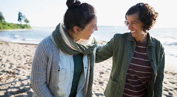 Two people smiling and embracing